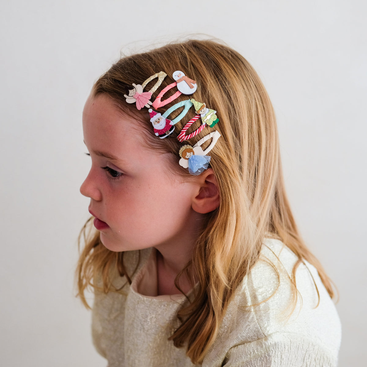 Young girl wearing Cute Christmas Character mini hair clips