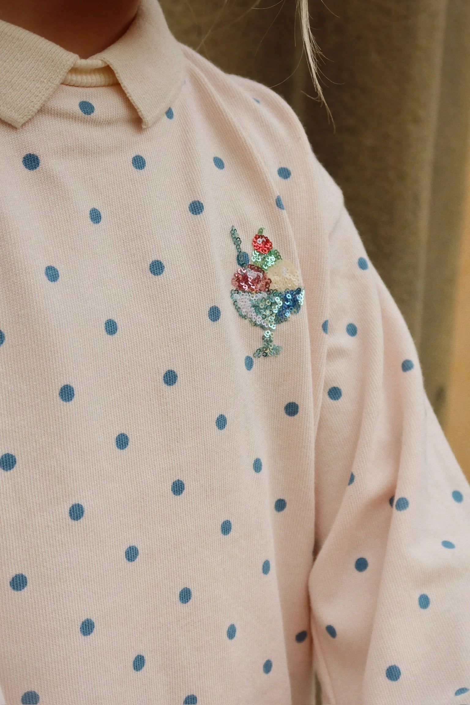 Detail of spotty print on Konges Sløjd long sleeve polo
