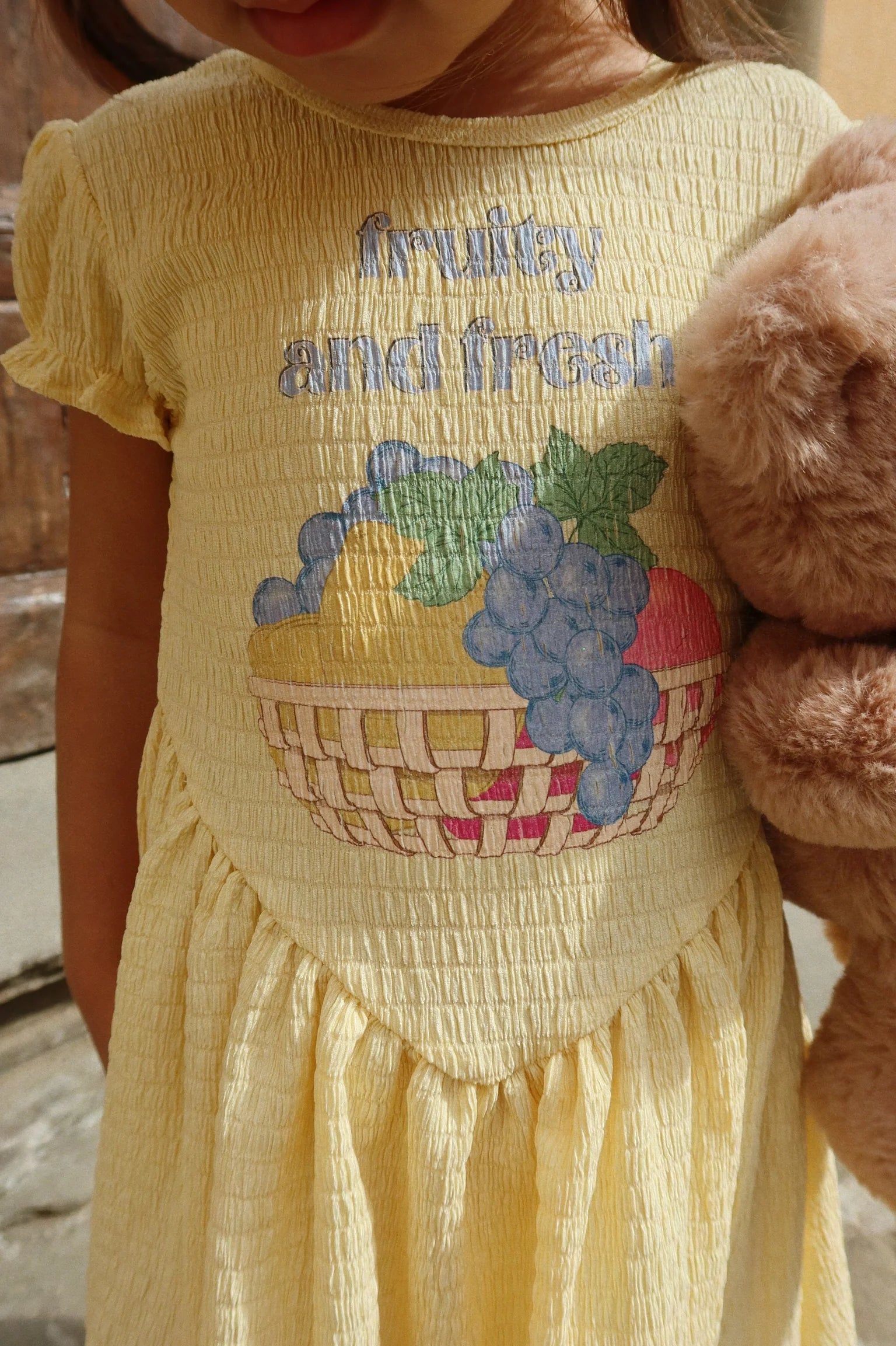 Child wearing Solilja Dress by Konges Sløjd outdoors, lightweight toddler dress for warm days