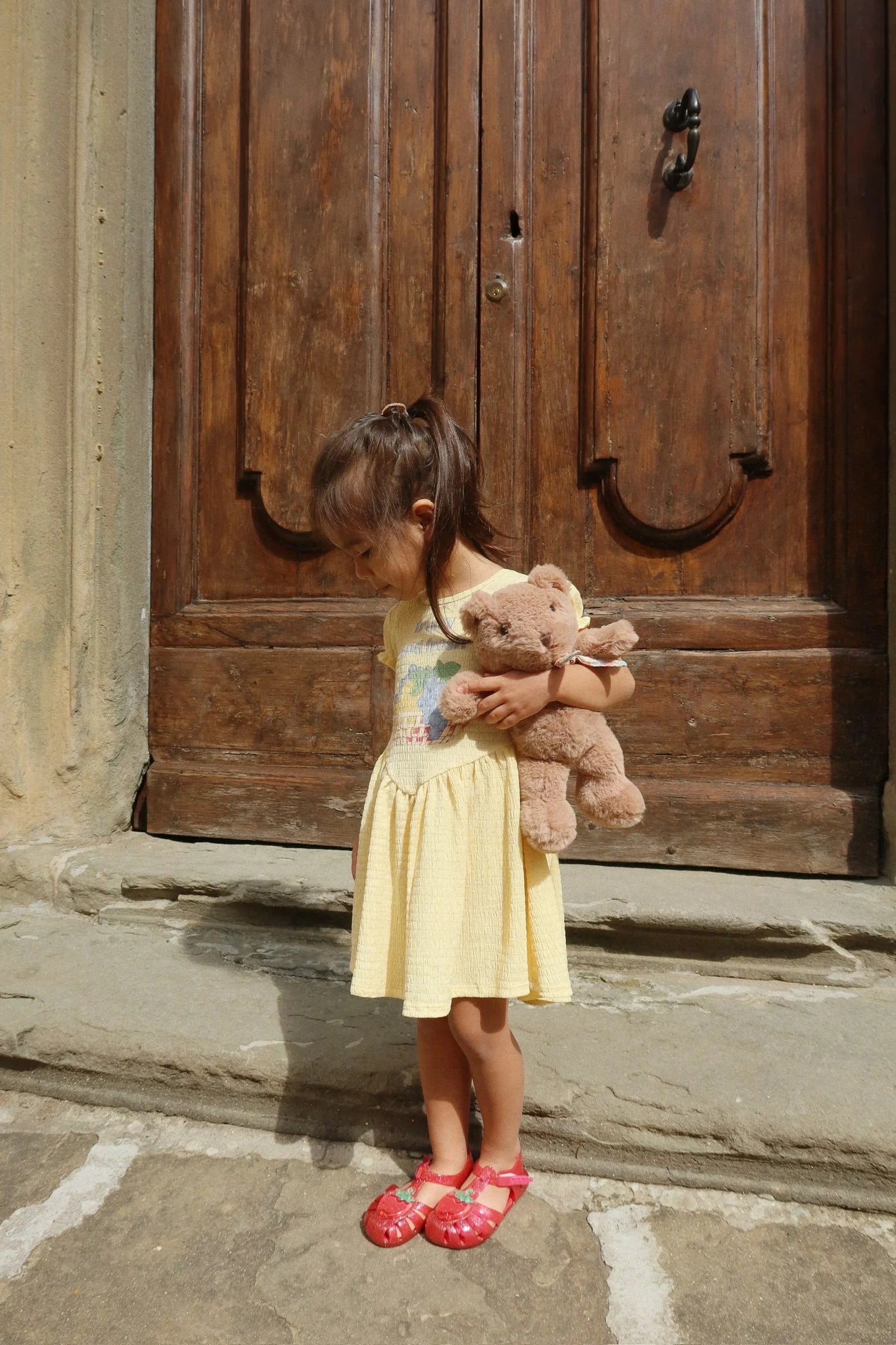 Child wearing Solilja Dress by Konges Sløjd outdoors, lightweight toddler dress for warm days