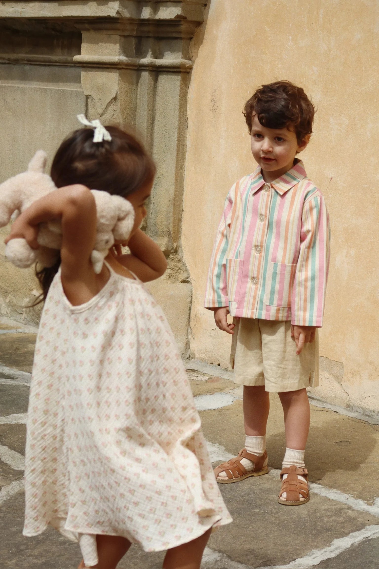 Child wearing Coco Strap Dress by Konges Sløjd outdoors, lightweight toddler summer dress