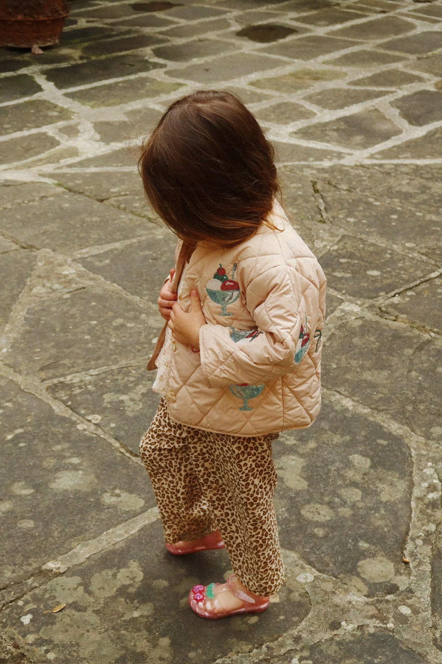 Toddler wearing pink Lilo sandals outdoors, Scandinavian style summer sandals for kids