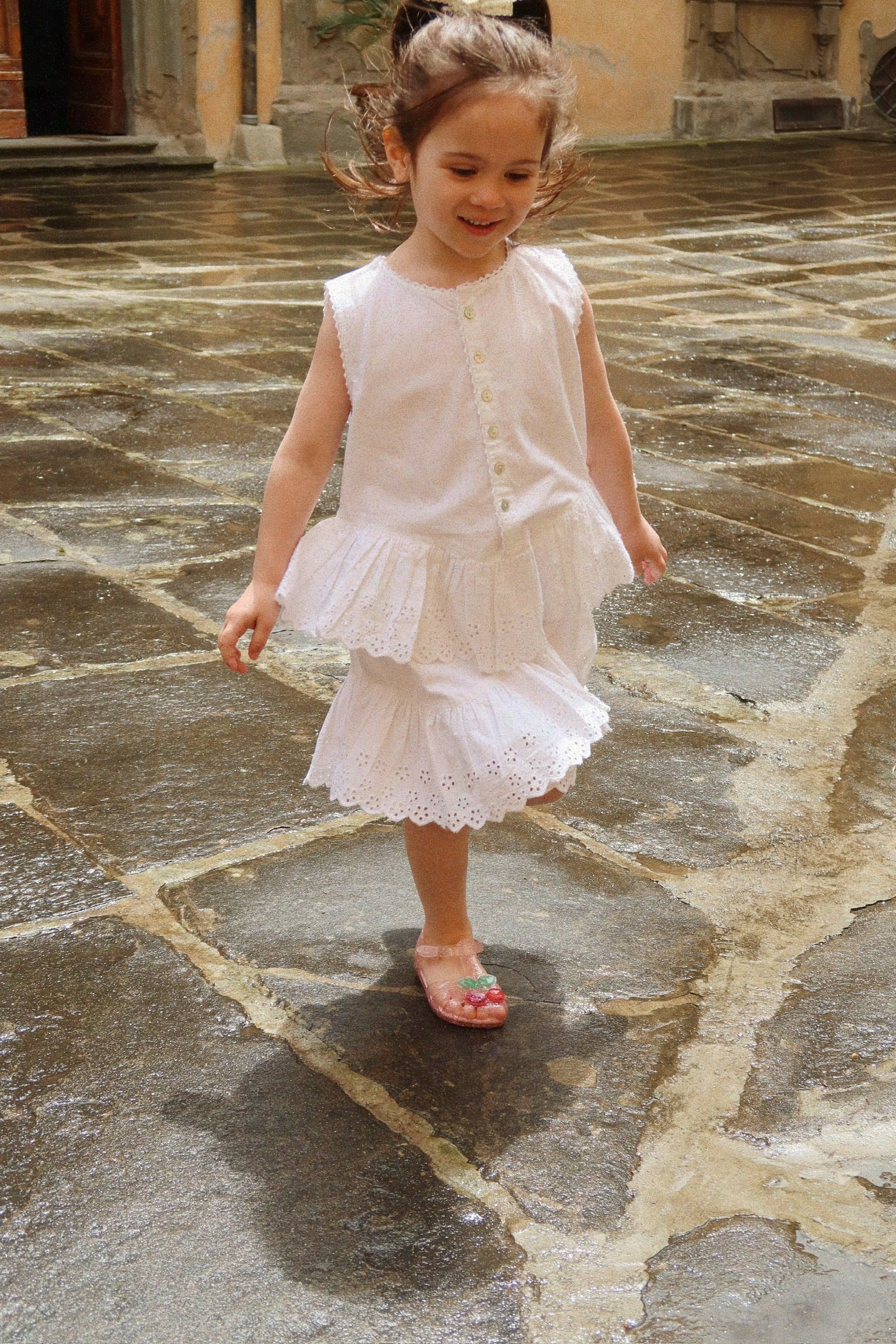 Young child wearing pink Lilo sandals by Konges Sløjd, lightweight sandals for warm weather