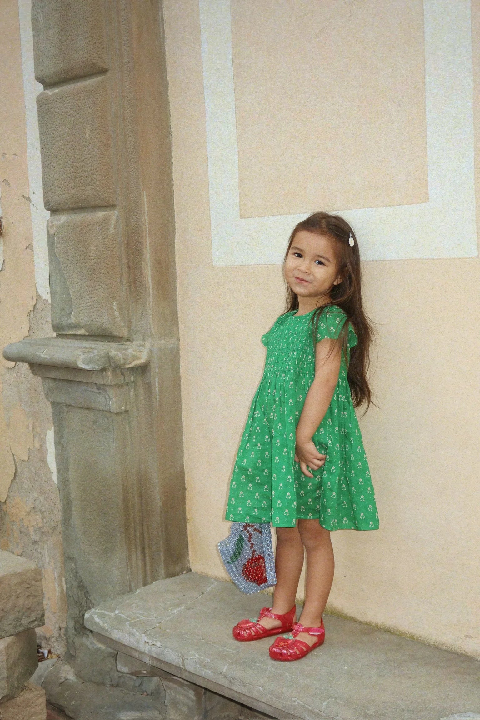 Toddler wearing red Lilo sandals by Konges Sløjd, comfortable summer sandals for everyday play