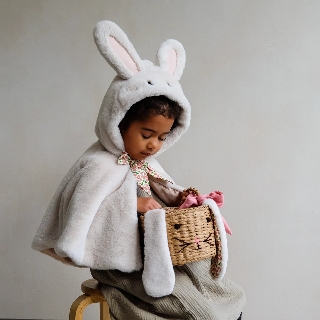 child holding Mimi and Lula bunny easter basket