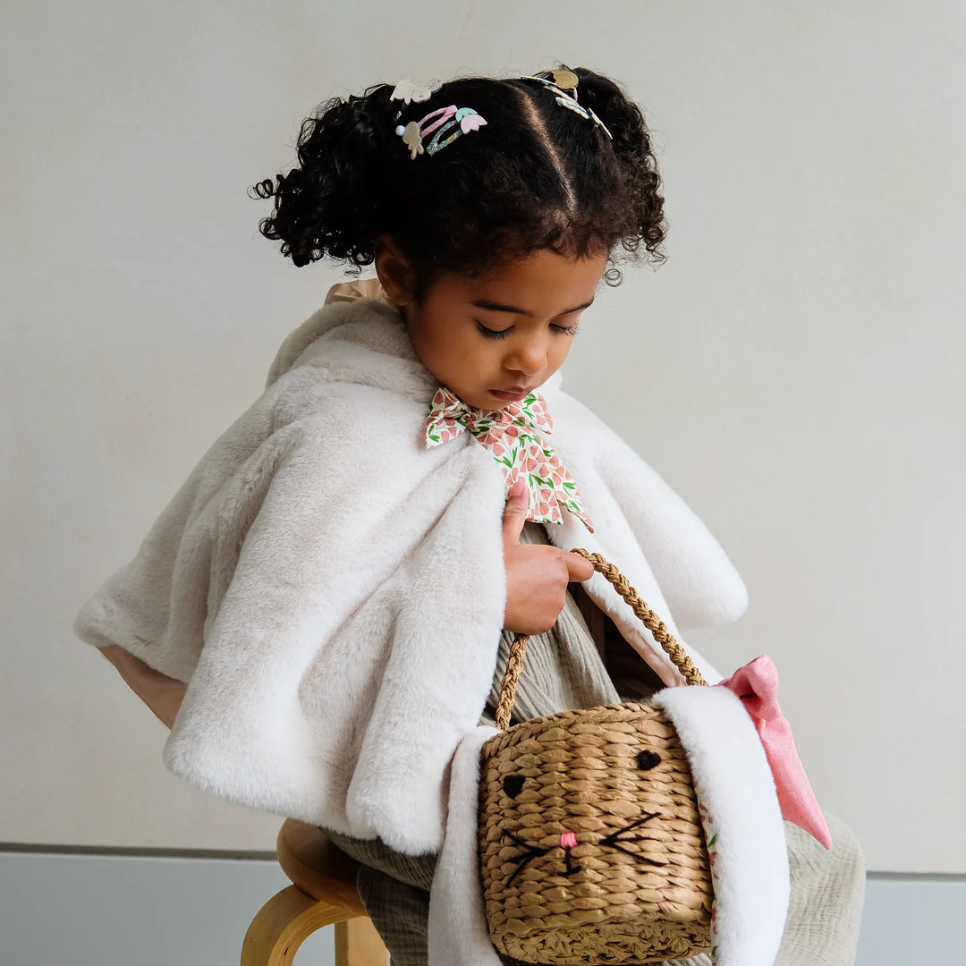 child wearing Mimi and Lula bunny cape costume
