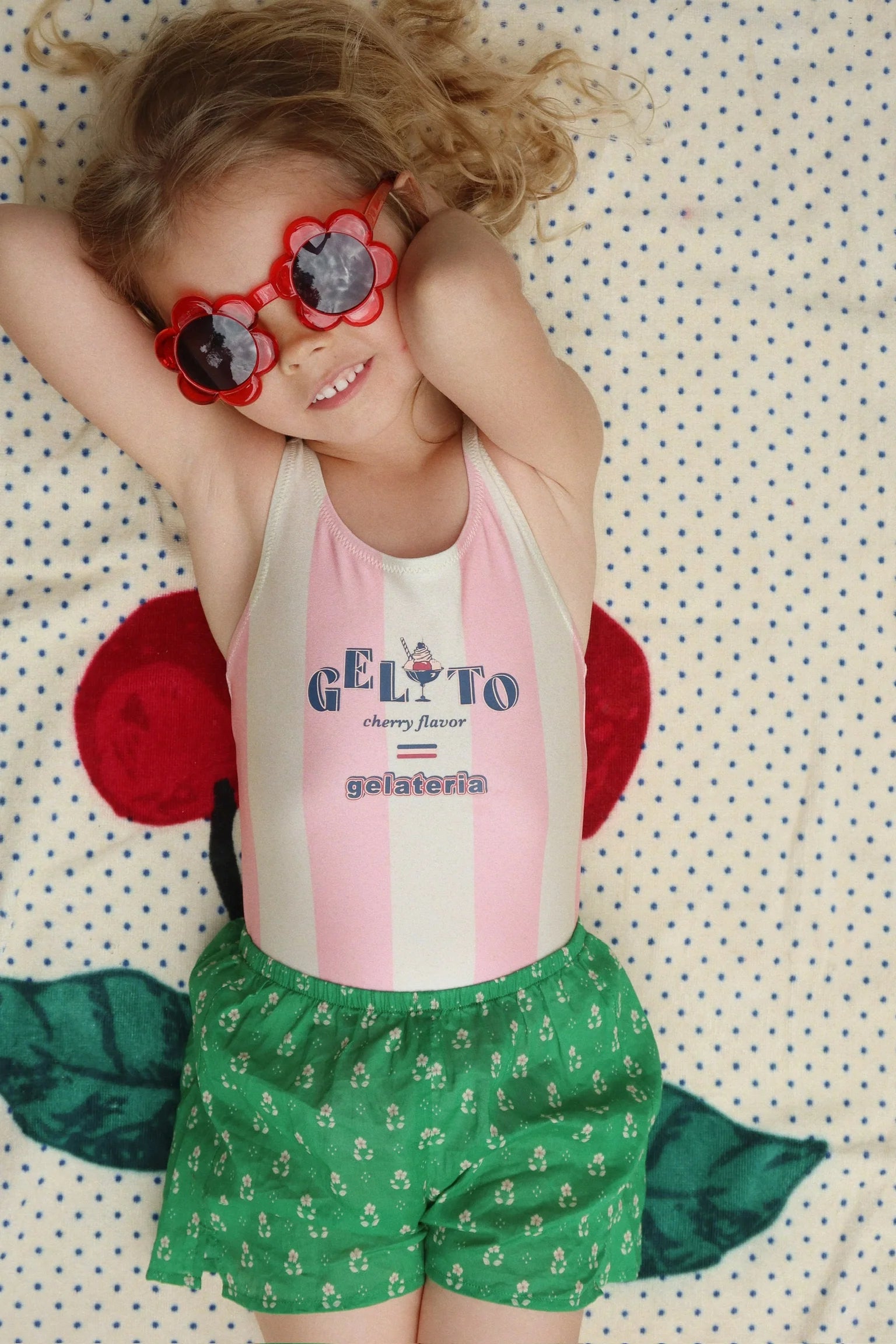 girl wearing Konges Sløjd Pomia swimsuit at pool
