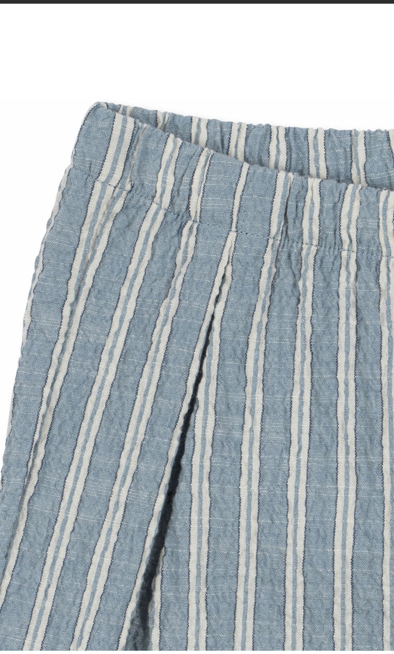 Close-up of striped fabric detail on Konges Sløjd Elliot GOTS organic cotton trousers
