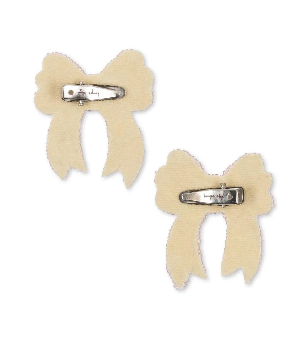 Back view of Konges Sløjd white sequin bow hair clips with clip fastening