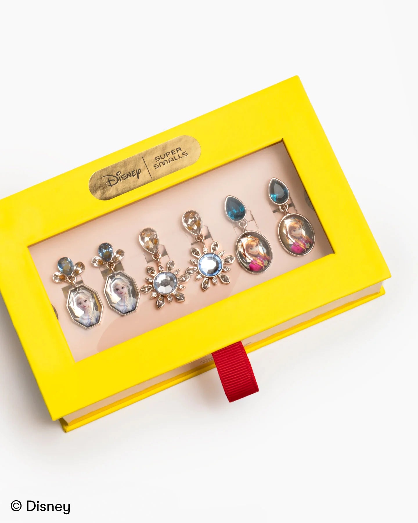Child wearing Disney Frozen Earring Set with Disney-inspired accessories