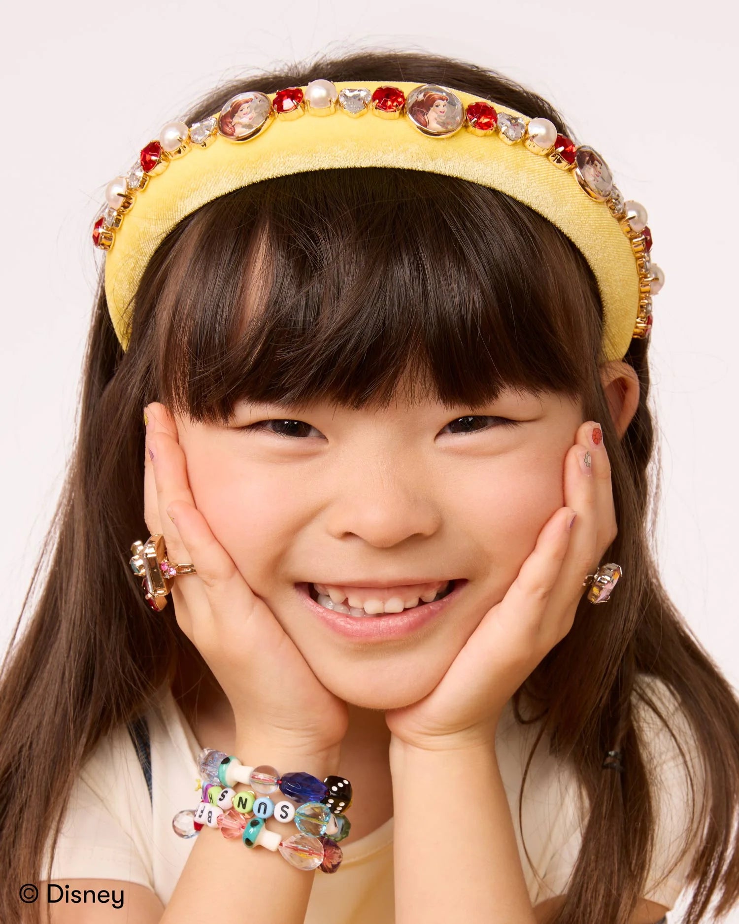 Child wearing Disney Belle's Royal Rose Headband