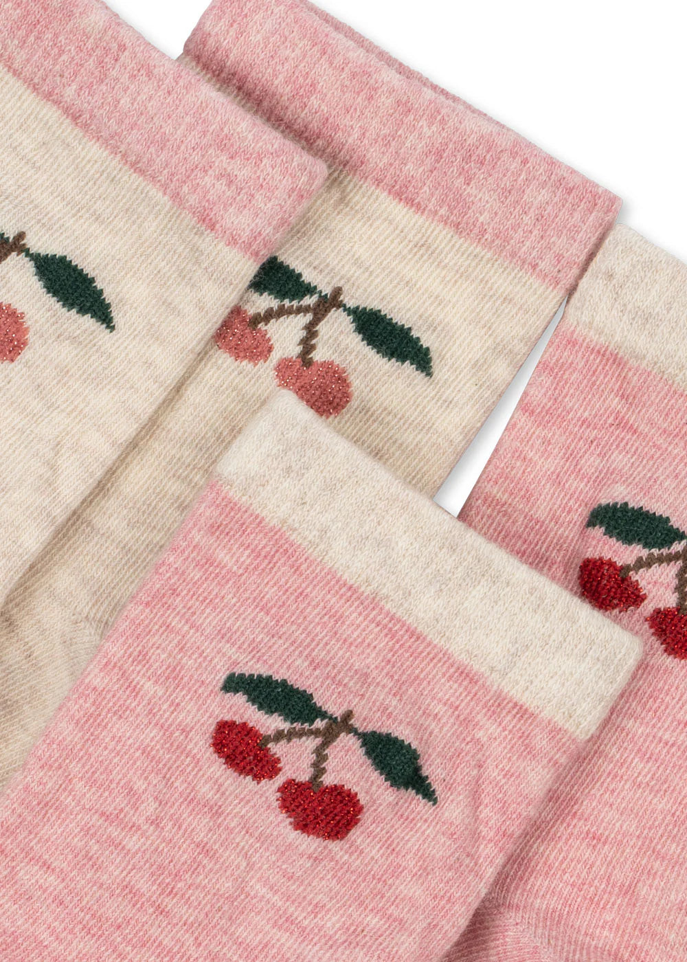 Close-up of embroidered cherry detail on Konges Sløjd pink and cream kids socks