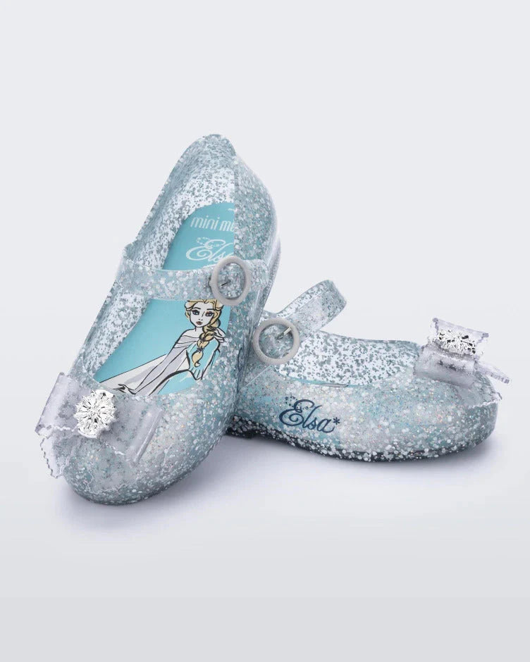 Mini Melissa Sweet Love Princess in Blue — shimmering icy blue jelly kids ballet flat with floral and snowflake embellishments, pair shown on white background