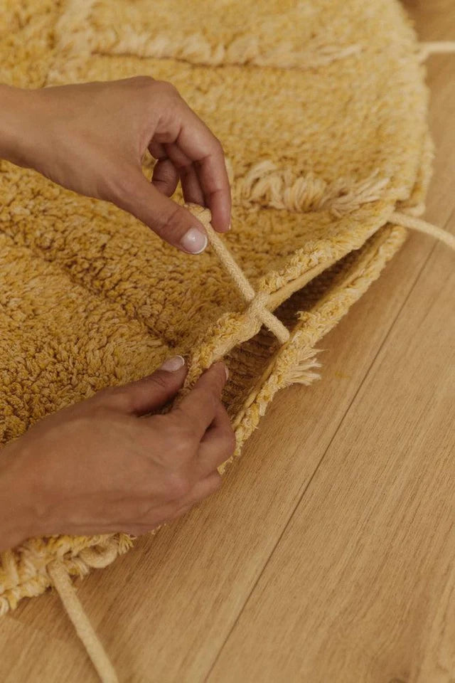 Washable Cotton Rug Solar Multishape by Lorena Canals shown at scale in a nursery