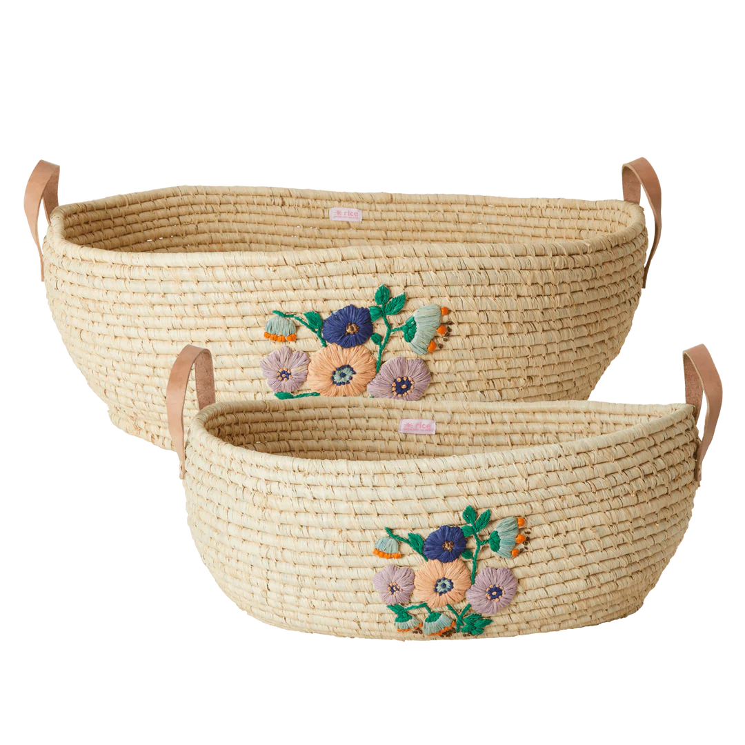 riceby rice® raffia small oval basket with hand-painted floral embroidery in a Scandinavian kids room