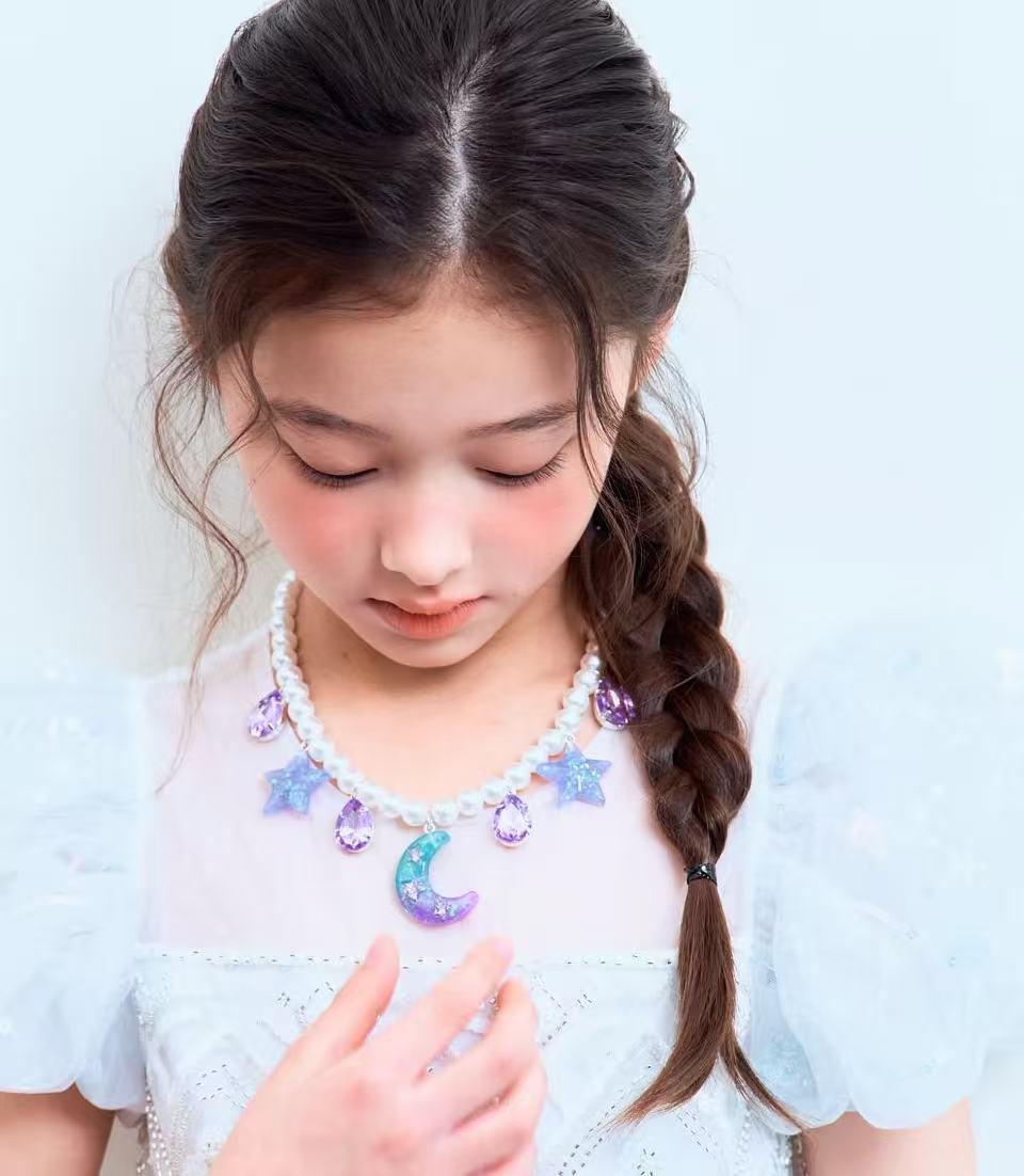 RuruStar Moon & Star Glow in the Dark Statement Necklace — necklace glowing in the dark showing moon and star glow detail