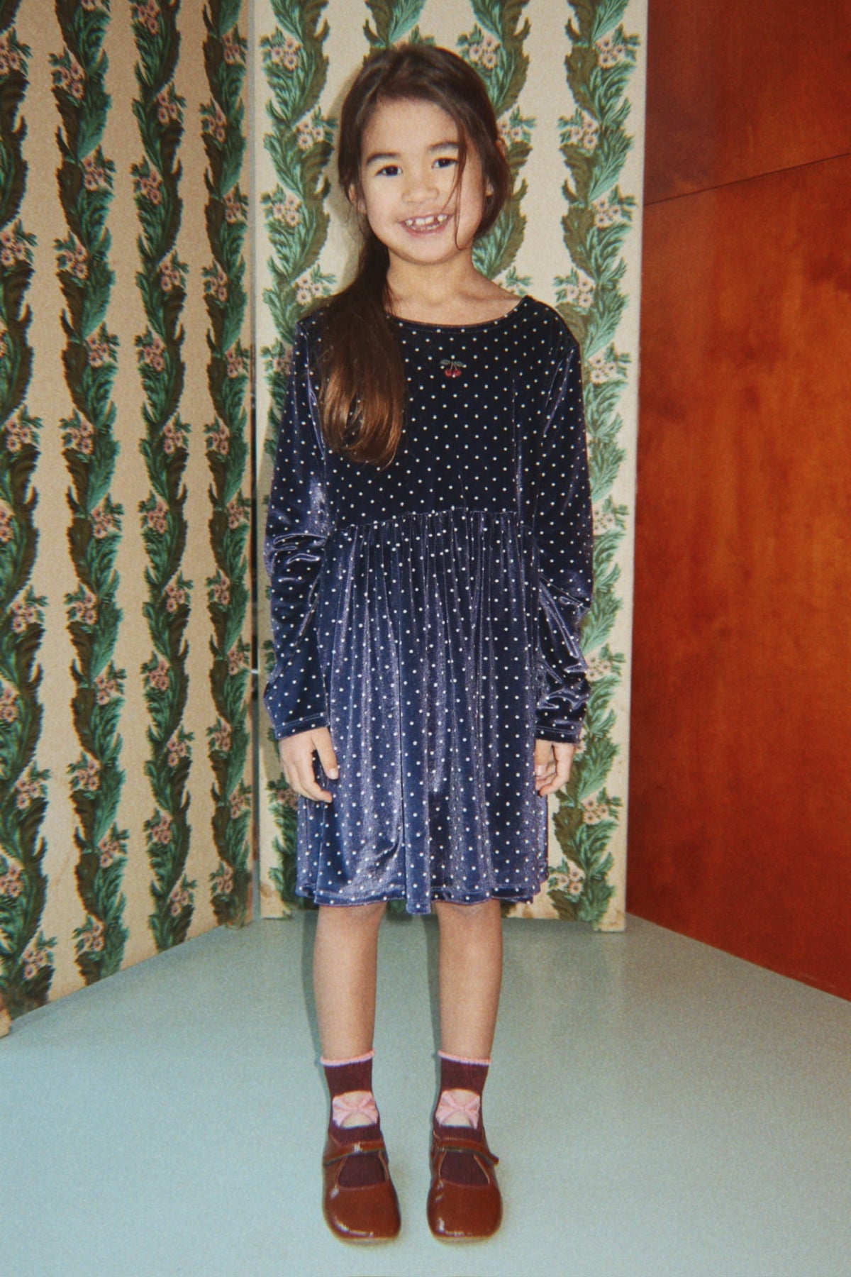 Girl wearing Konges Sløjd Ditzy Dress in Ditzy Dot