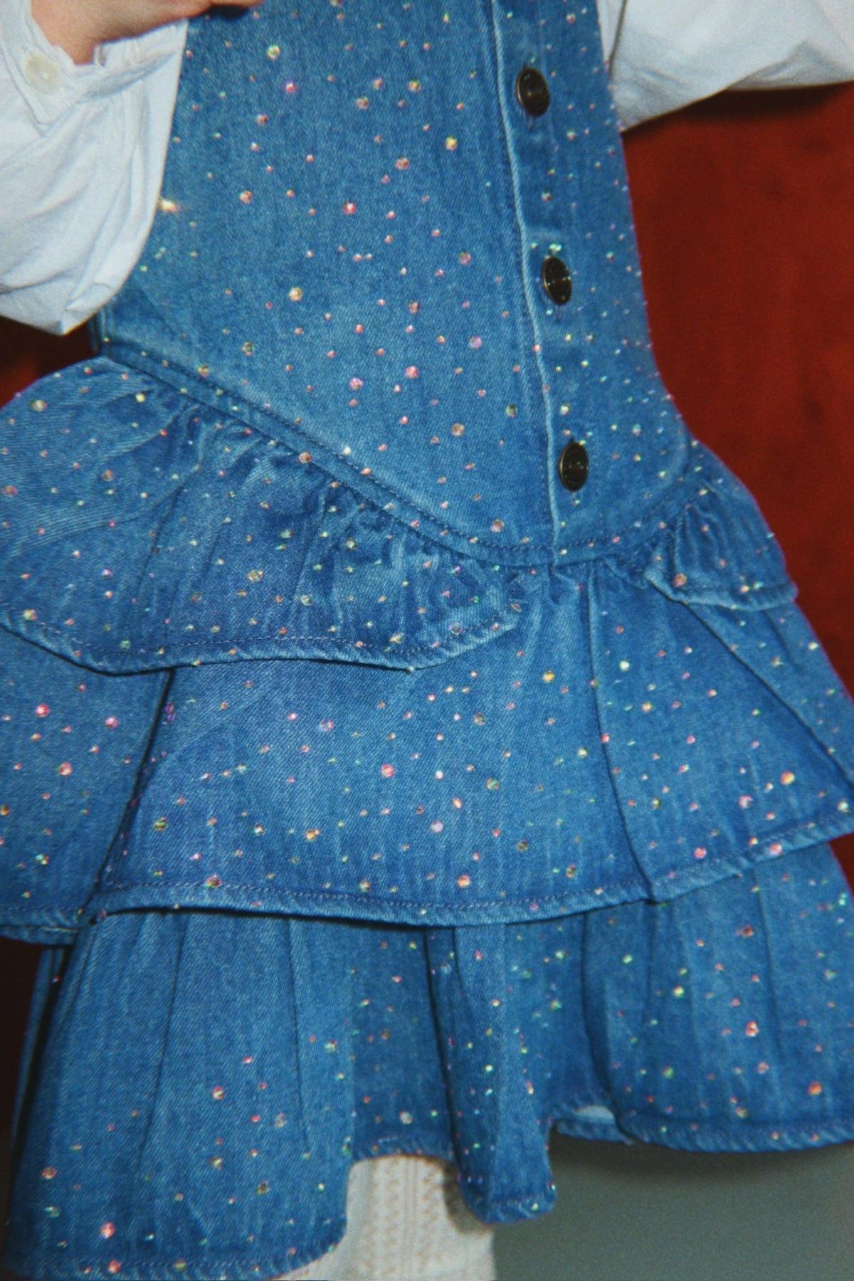 Girl wearing Konges Sløjd Elba Sparkle Dress in Denim Sparkle
