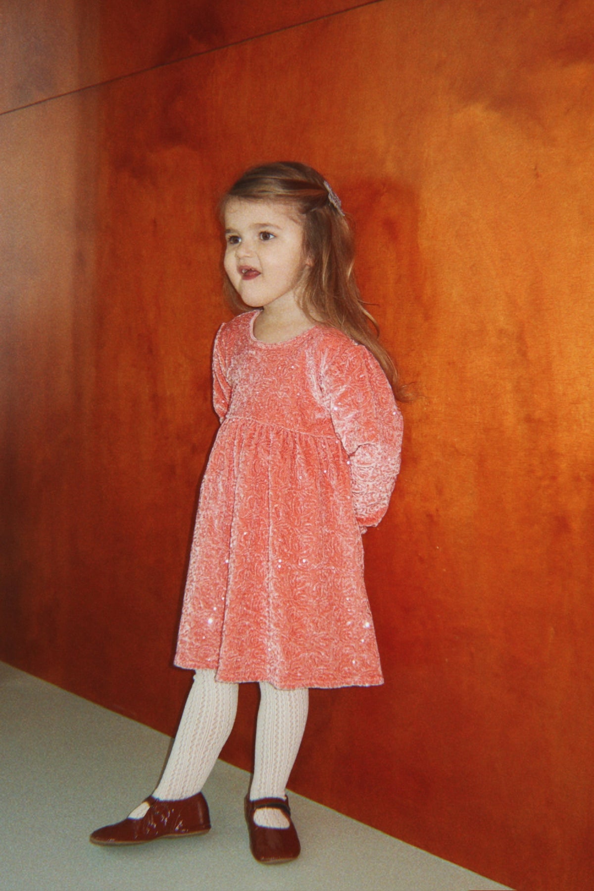 Girl wearing Konges Sløjd Gia Sparkle Dress in Lantana