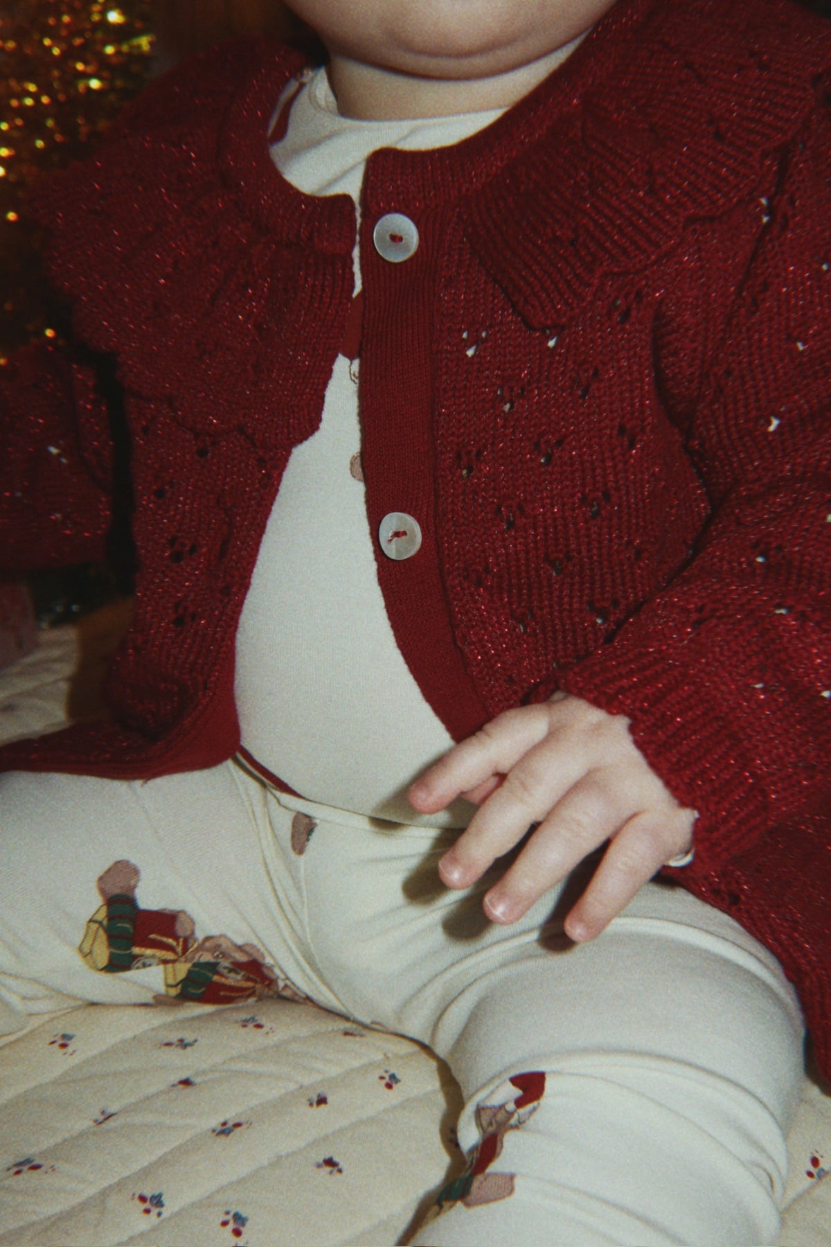 Konges Sløjd Holiday Cardigan in Red Dahlia, lifestyle image 2