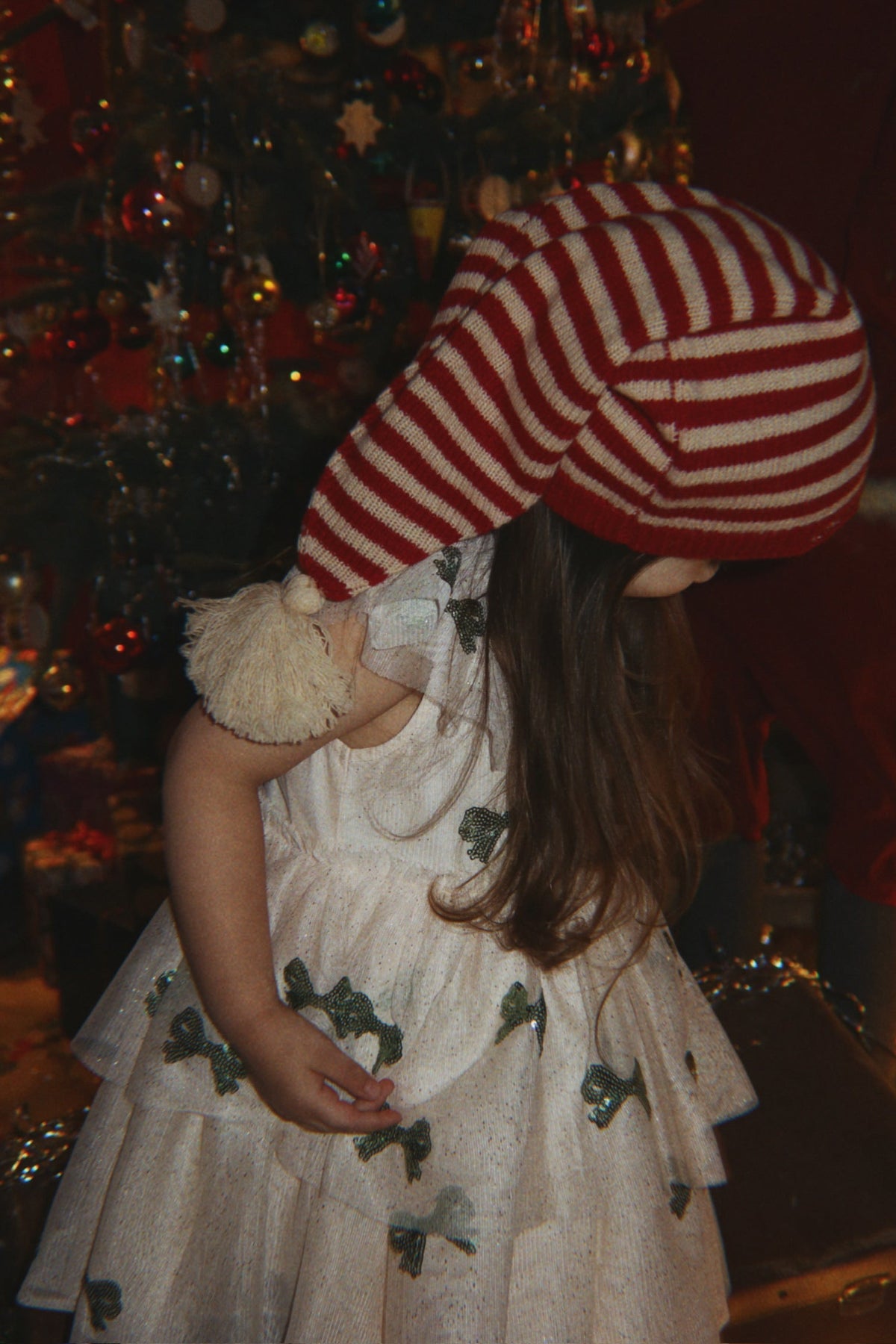 Konges Sløjd Christmas Knit Hat in Christmas Stripe, lifestyle image worn by child