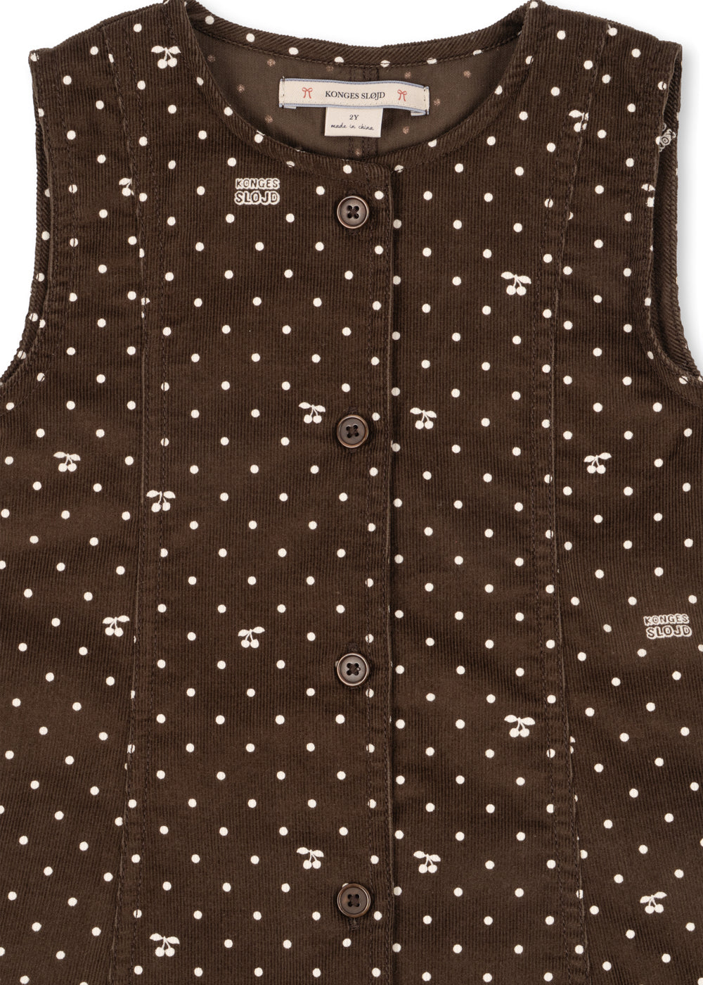 Close-up of the button front and cherry-dot print on the Cara dress