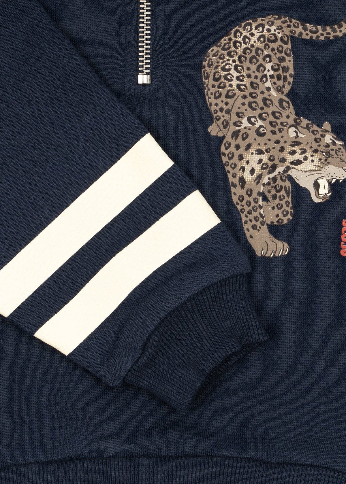 Close-up of the leopard graphic and cream sleeve stripes