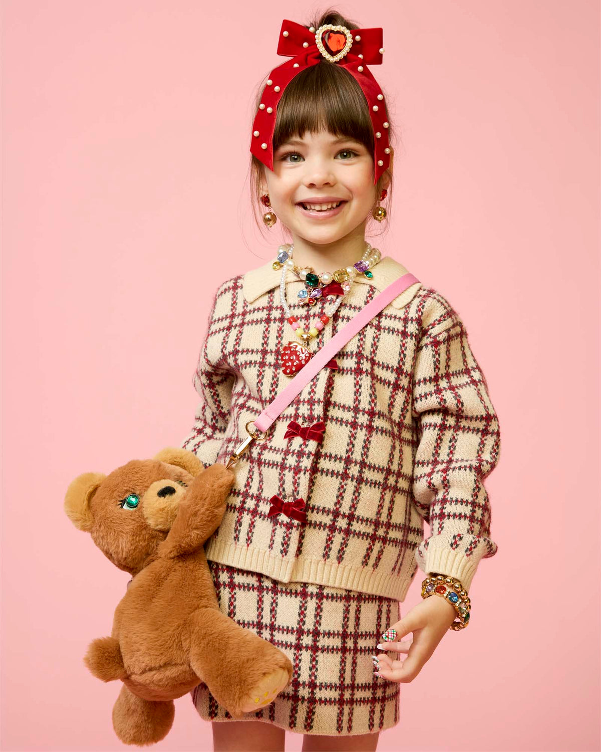 Child wearing the Esme Plush Bear Bag