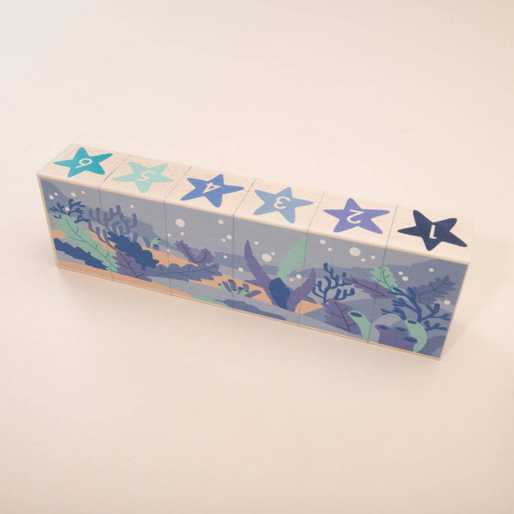 Clamshell puzzle piece with hidden pearl from the Uncle Goose Ocean Blocks set