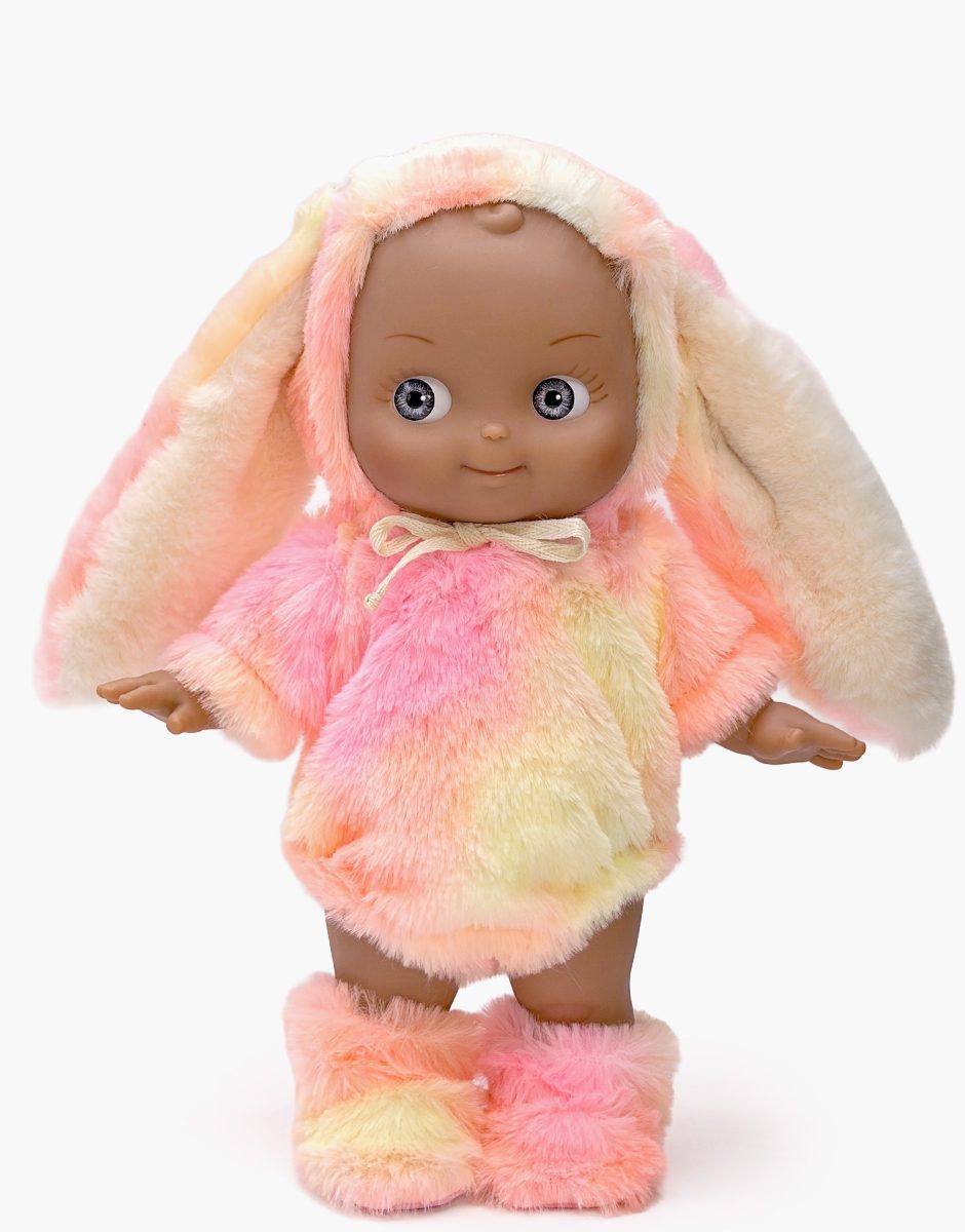 Maïa Mini Pancha doll in pink rainbow faux fur bunny outfit by Minikane