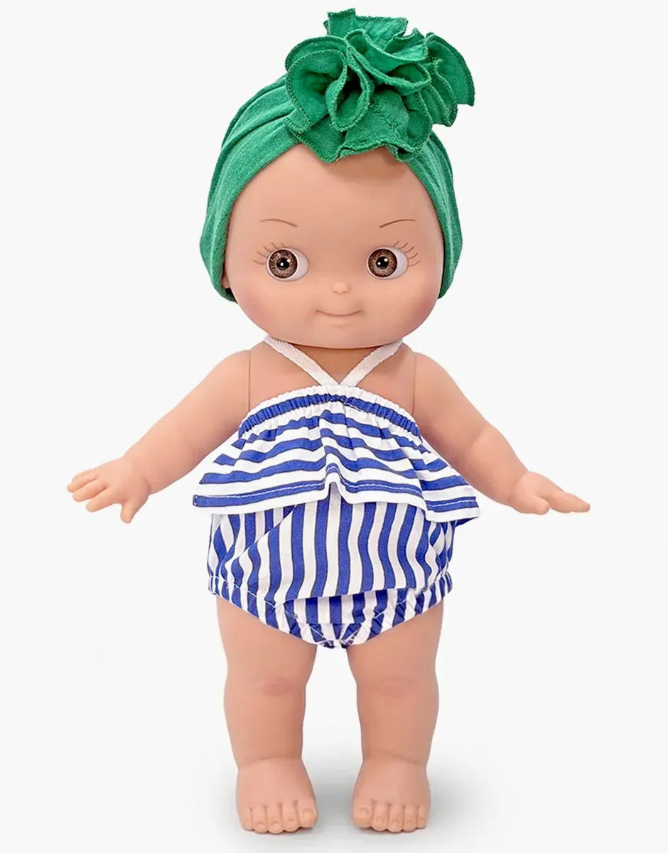 Ninon Mini Pancha doll in green and blue stripe beach set by Minikane