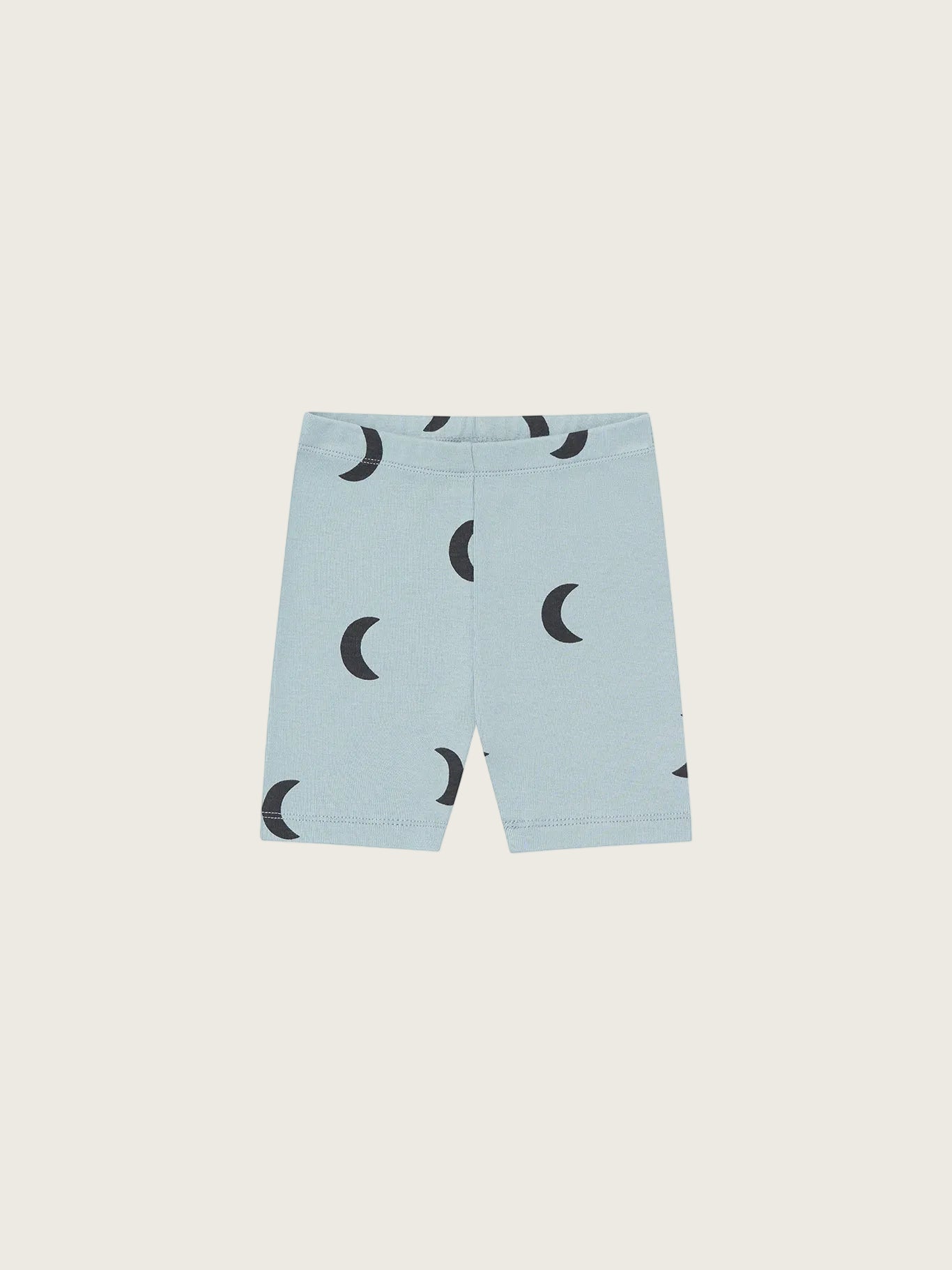 Organic Zoo River Midnight Biker Shorts — fitted organic cotton kids biker shorts with dreamy blue moon print, flat lay on cream background