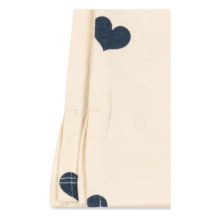Side view detail of Konges Sløjd Drey organic cotton pants with heart pattern