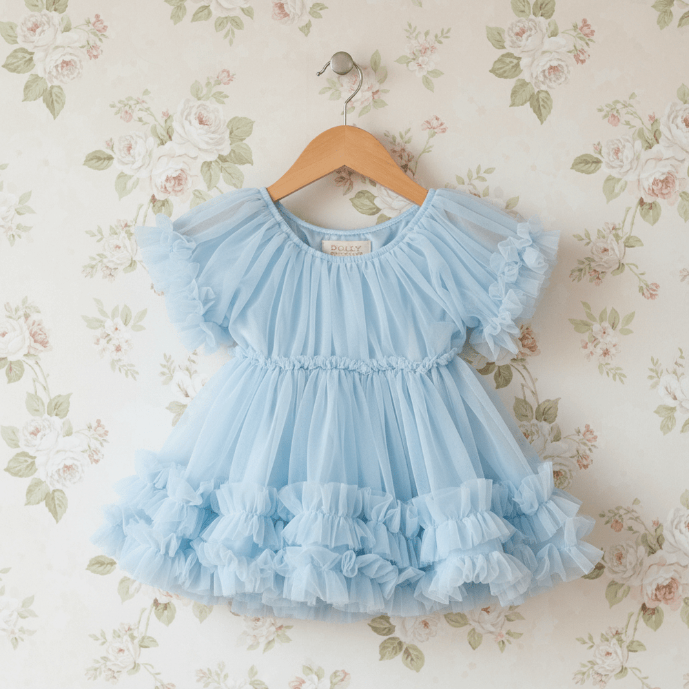 DOLLY by Le Petit Tom Frilly Dress in Light Blue — puff sleeve soft chiffon dress with ruffled layers for girls, hanging on hanger