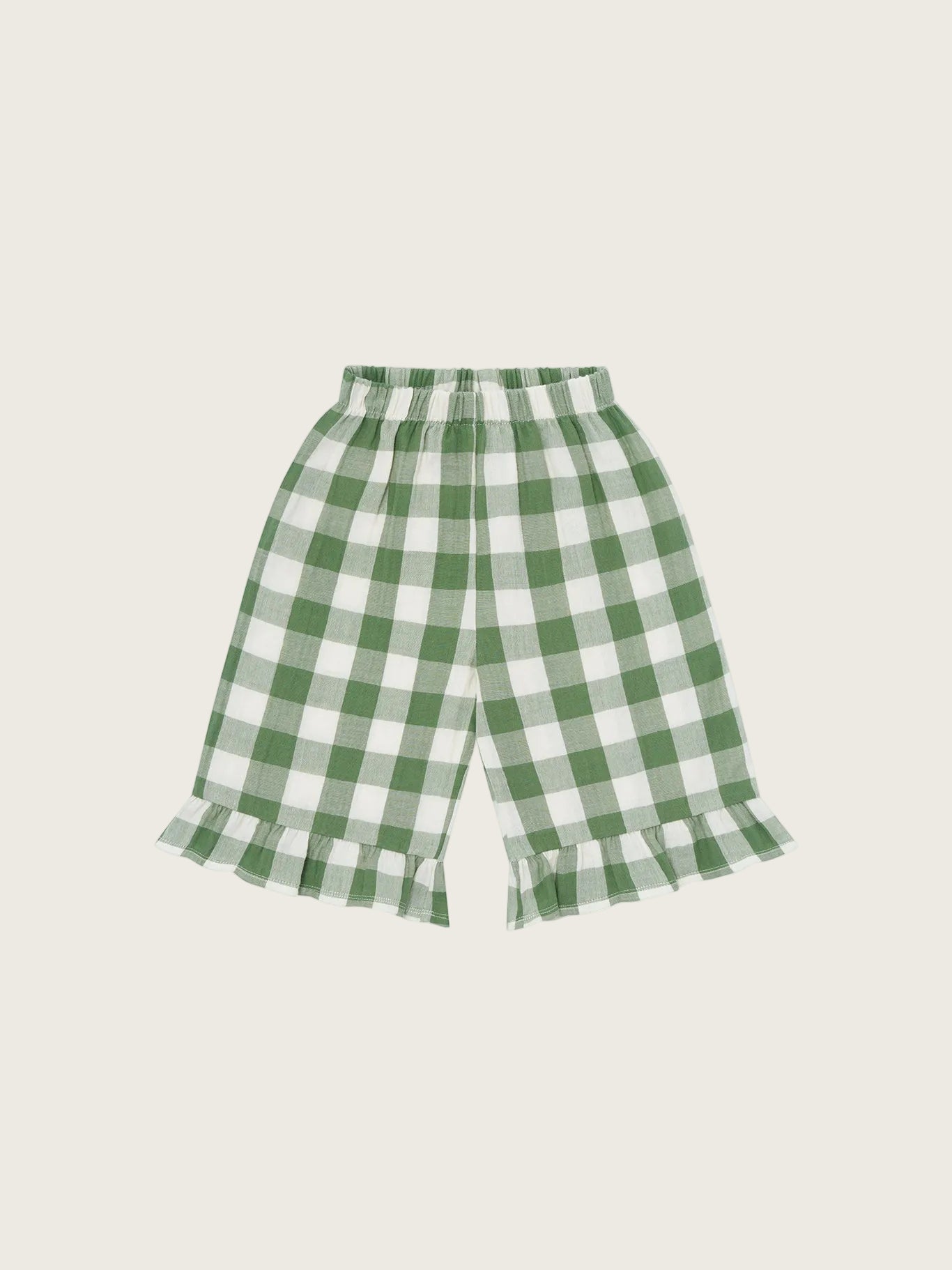 Organic Zoo Dill Gingham Frill Culottes — loose fit organic muslin kids culottes with frill trim and fresh green dill gingham print, flat lay on cream background