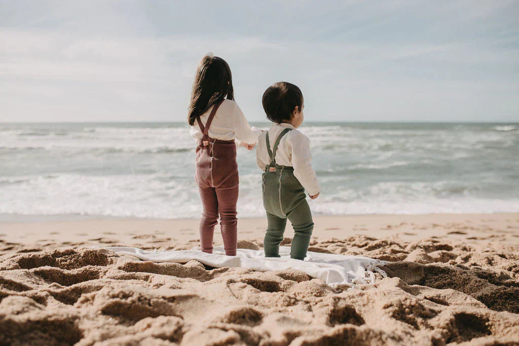 Children wearing Silly Silas baby tights with suspenders