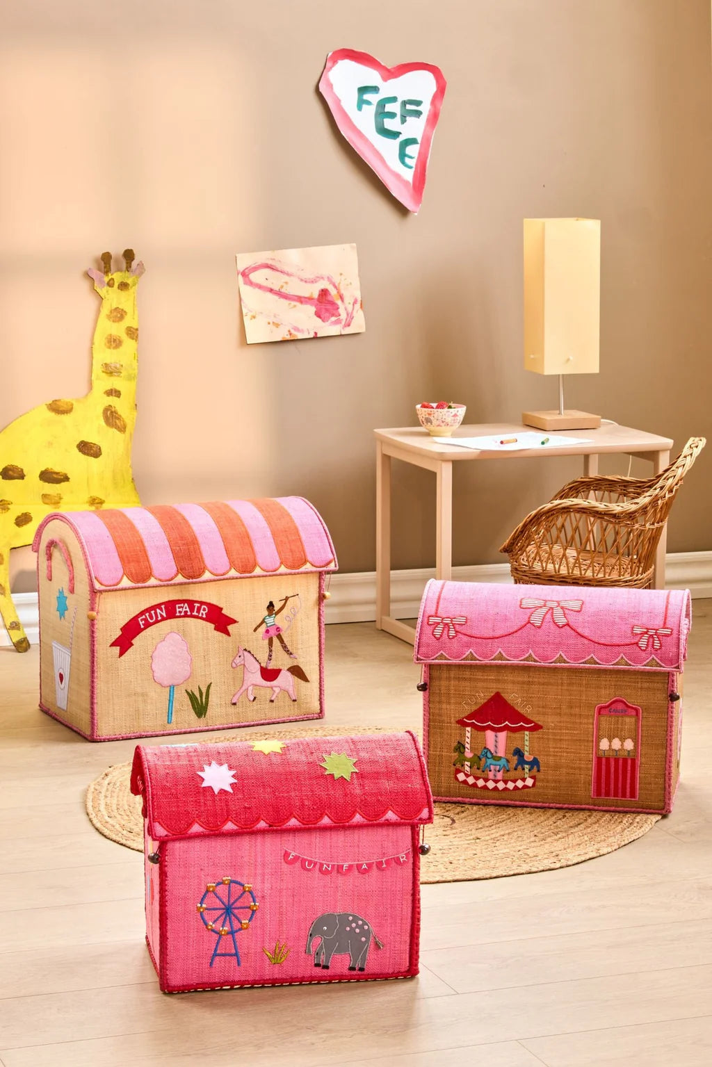 riceby rice® raffia storage baskets with Nathalie Lété illustrations displayed in a Scandinavian kids room