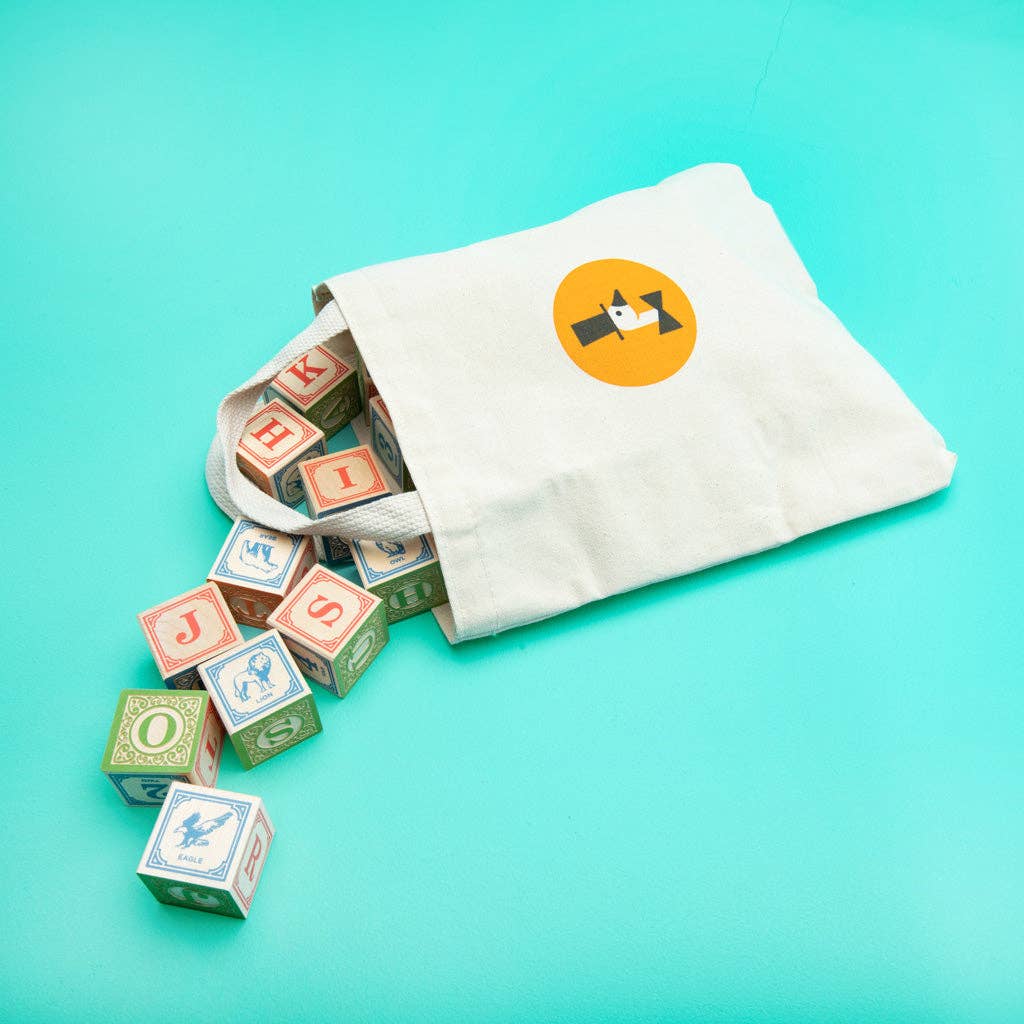 28 classic ABC wooden blocks packed inside the Uncle Goose canvas bag