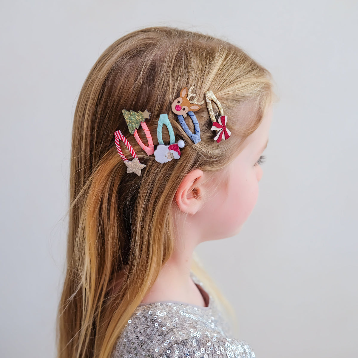 Young girl wearing Christmas mini hair clips