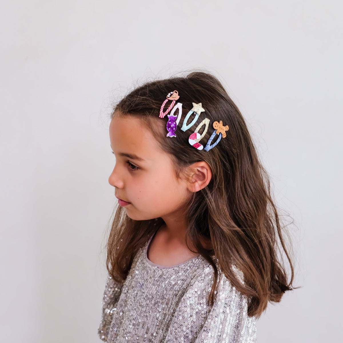 Young girl wearing Cosy Christmas Food mini hair clips