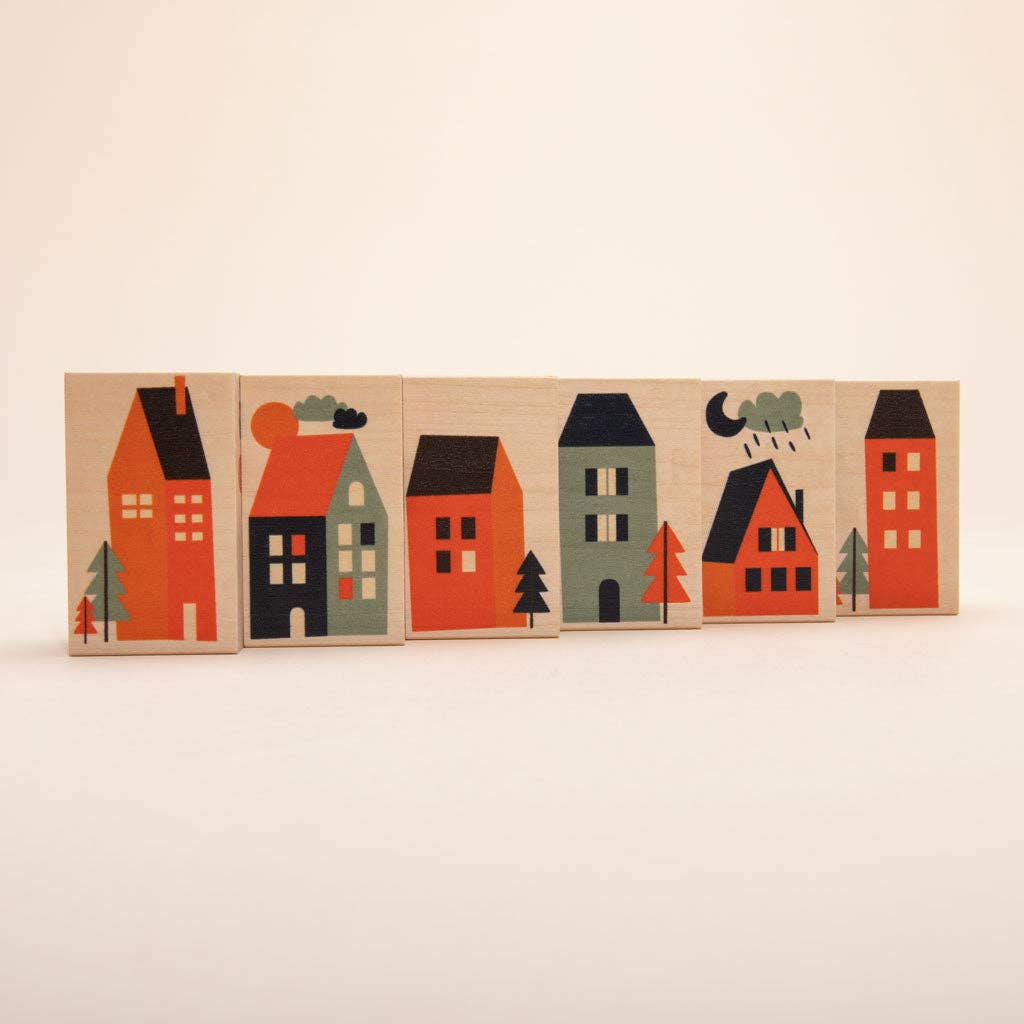 Close-up of neighborhood wooden blocks with house illustrations