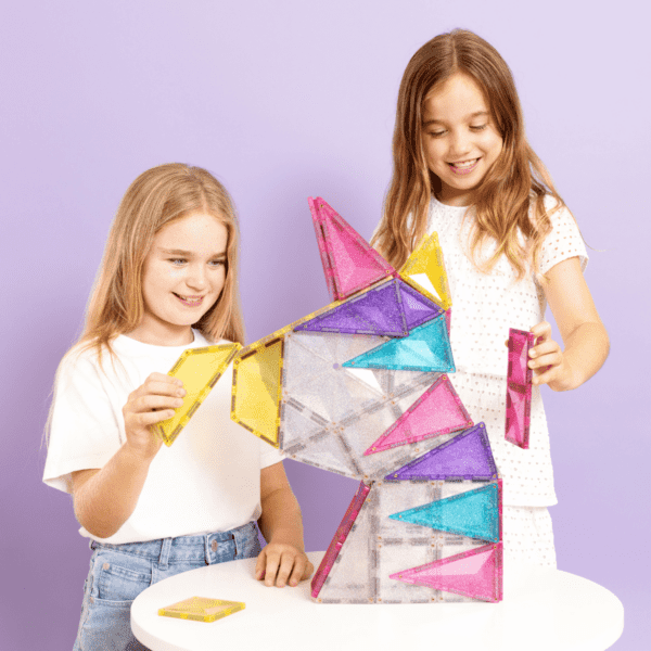 Child building with CONNETIX Glitter Unicorn Pack magnetic tiles