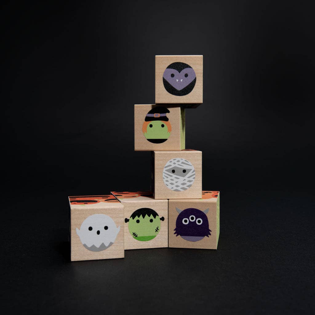 Halloween wooden blocks arranged to show mummy and monster block faces