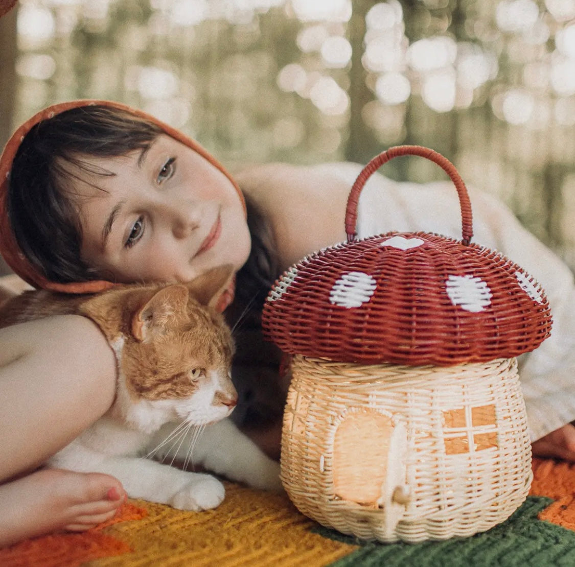 OlliElla Rattan Mushroom Basket in red — natural handwoven toy storage basket for toddler nursery and Montessori playroom