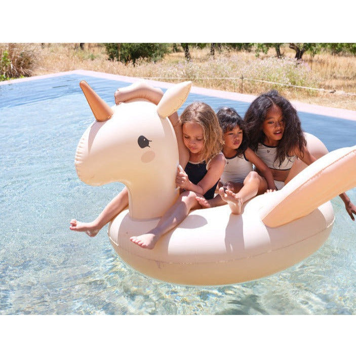 children playing with unicorn inflatable pool float summer pool