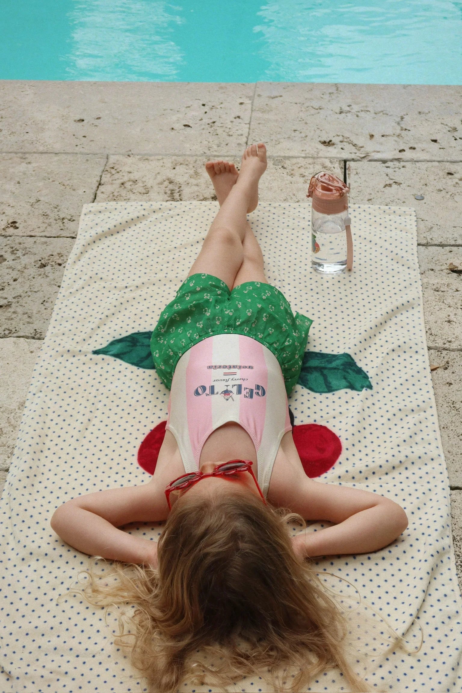 kids playing in Konges Sløjd Pomia swimsuit summer beach