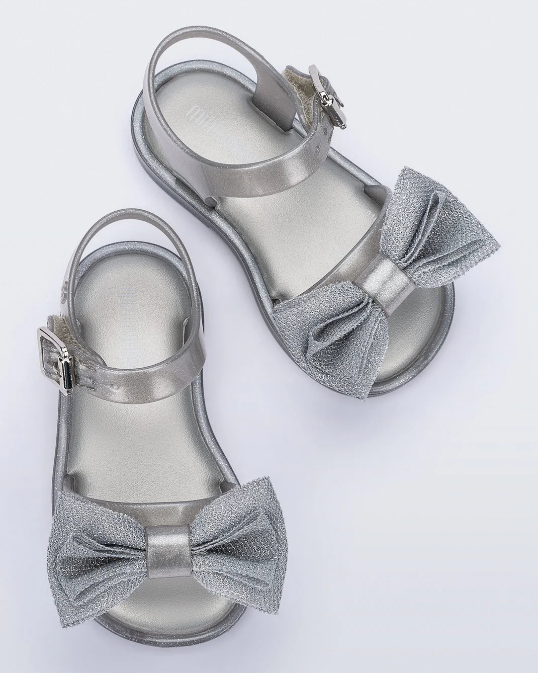 Mini Melissa Mar Sandal Sweet — silver-grey kids jelly sandal with bow detail, pair shown on white background