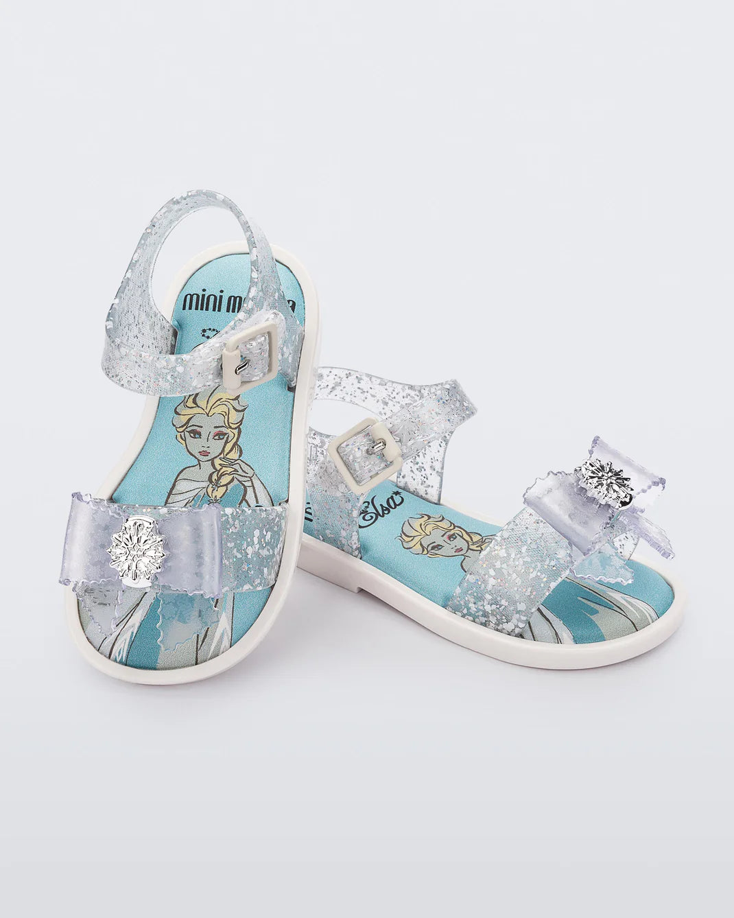 Mini Melissa Mar Sandal Princess — aqua blue floral print kids jelly sandal with transparent straps, pair shown on white background