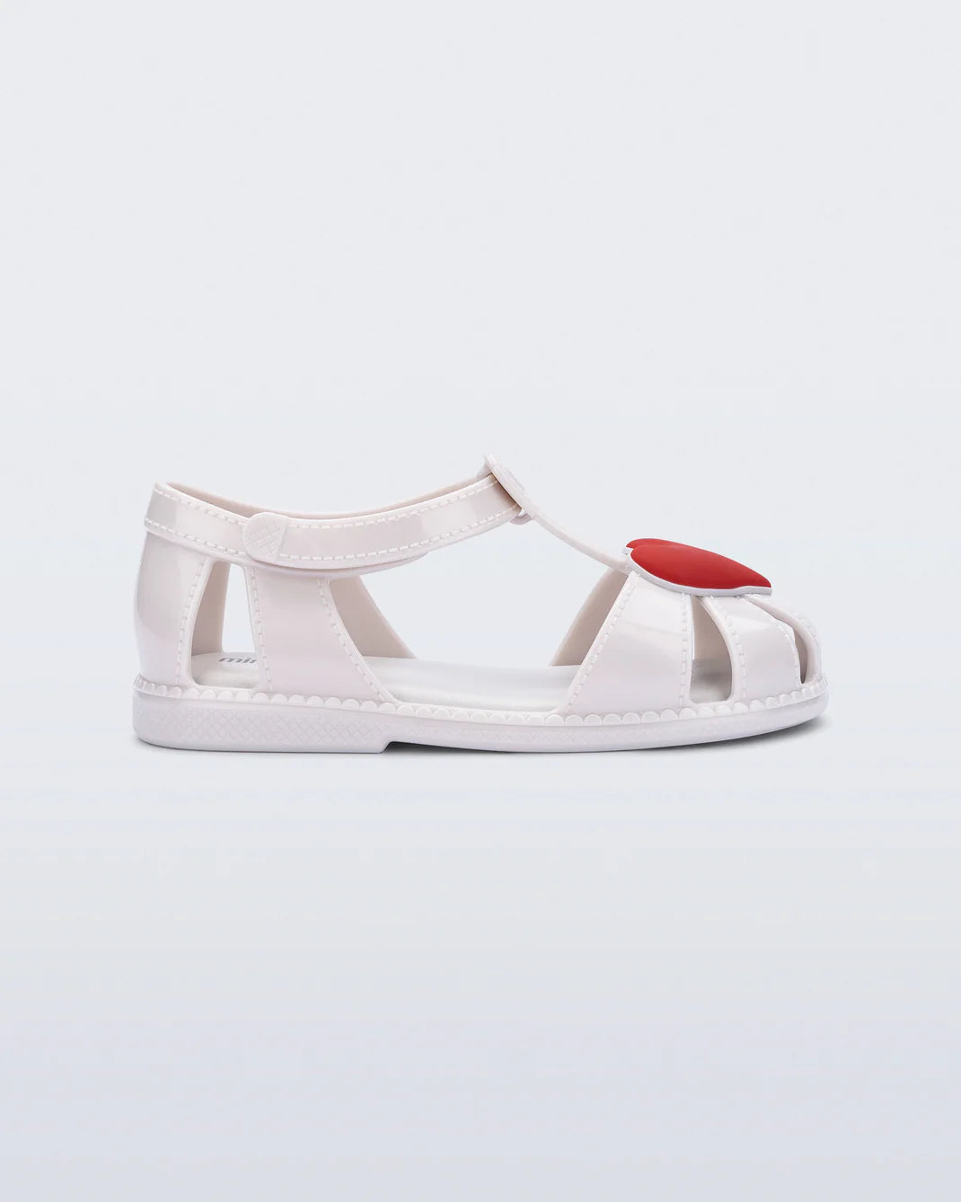 Mini Melissa Hip Heart Ballerina — white jelly kids sandal with red heart detail, pair shown on white background