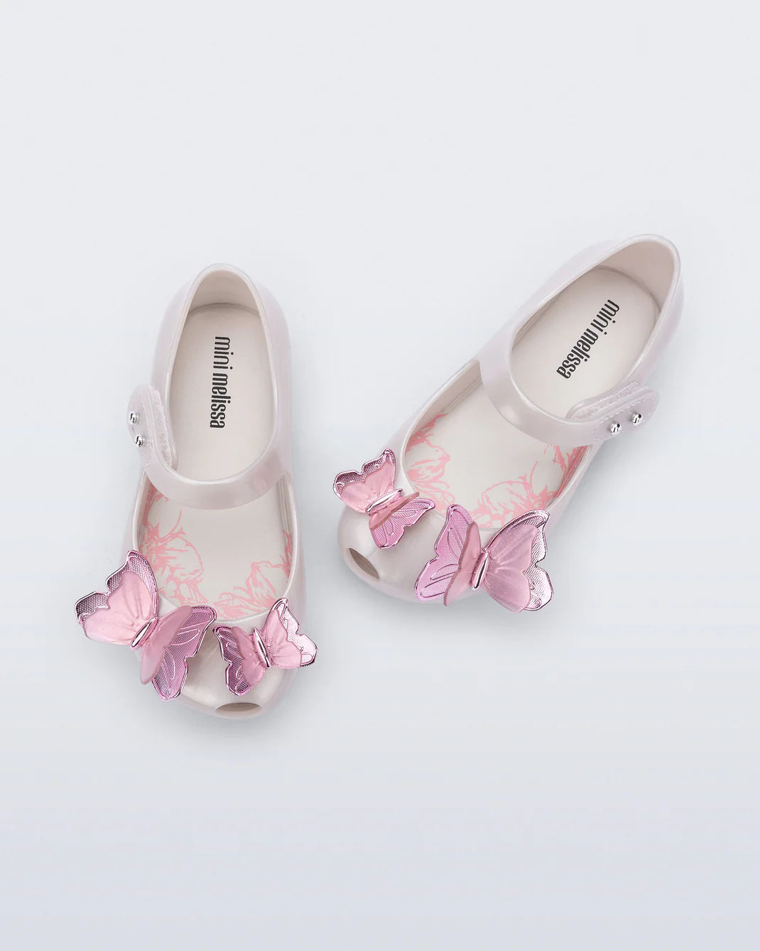 Mini Melissa Ultragirl Butterfly — pink jelly ballet flats with butterfly bow detail, pair shown on white background